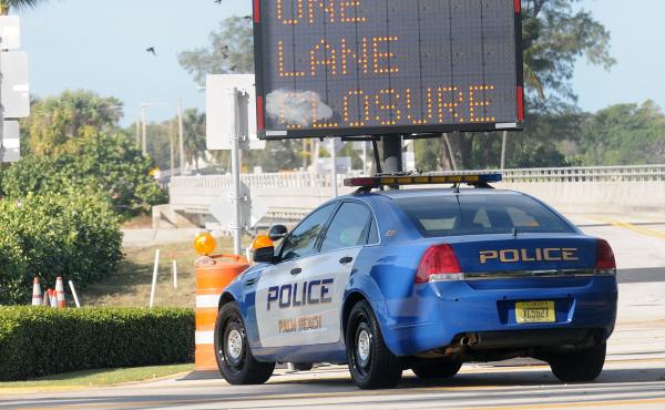 A Palm Beach Police car sits in front of a gate of the Mar-a-Lago Resort in November. During President Trump's frequent visits, the Secret Service shuts down a major thoroughfare, making it difficult to get anywhere in Palm Beach. A Palm Beach Police car sits in front of a gate of the Mar-a-Lago Resort in November. During President Trump's frequent visits, the Secret Service shuts down a major thoroughfare, making it difficult to get anywhere in Palm Beach.