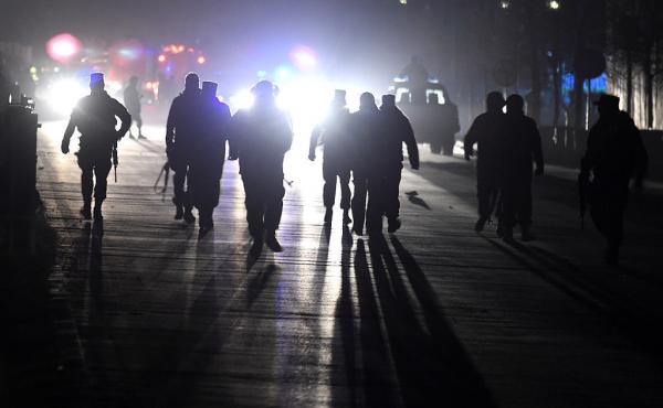 Afghan security personnel arrive at the site of two bombs on Tuesday near the Afghan parliament in Kabul. Afghan security personnel arrive at the site of two bombs on Tuesday near the Afghan parliament in Kabul.