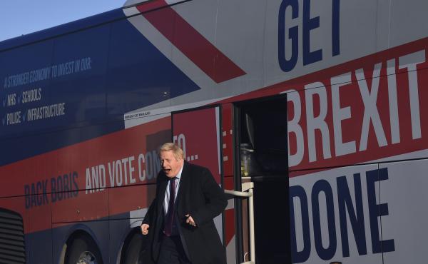 Britain's Prime Minister Boris Johnson gets off his election campaign bus — emblazoned with the slogan "Get Brexit Done" — to visit Washington, England, on Monday. Britain goes to the polls on Thursday. Britain's Prime Minister Boris Johnson gets off his election campaign bus — emblazoned with the slogan "Get Brexit Done" — to visit Washington, England, on Monday. Britain goes to the polls on Thursday.