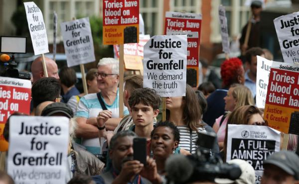 Londoners protest outside a Kensington Council meeting to discuss Grenfell Tower on July 19. British police say there are grounds to suspect the council and other local authorities of committing corporate manslaughter in the fire that killed at least 80 p Londoners protest outside a Kensington Council meeting to discuss Grenfell Tower on July 19. British police say there are grounds to suspect the council and other local authorities of committing corporate manslaughter in the fire that killed at least 80 p