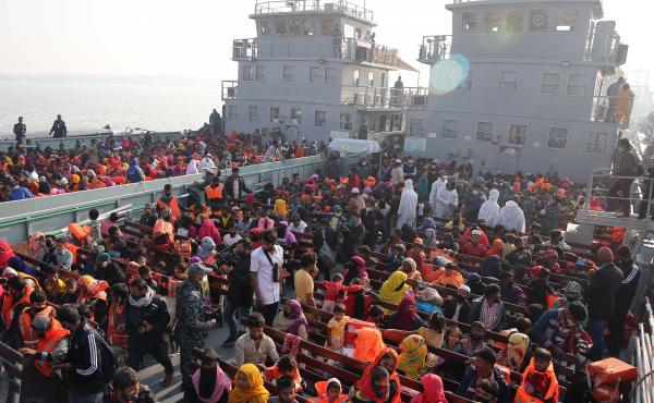 In this Dec. 29, 2020, file photo, Rohingya refugees wait on naval ships to be transported to an isolated island in the Bay of Bengal, in Chittagong, Bangladesh. In this Dec. 29, 2020, file photo, Rohingya refugees wait on naval ships to be transported to an isolated island in the Bay of Bengal, in Chittagong, Bangladesh.