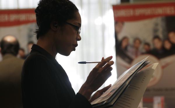Joana Dudley looks at a list of job prospects at a job fair in Miami Lakes, Fla., in January. In the government's June jobs report, the unemployment rate ticked up to 4 percent with more people entering the labor force. Joana Dudley looks at a list of job prospects at a job fair in Miami Lakes, Fla., in January. In the government's June jobs report, the unemployment rate ticked up to 4 percent with more people entering the labor force.