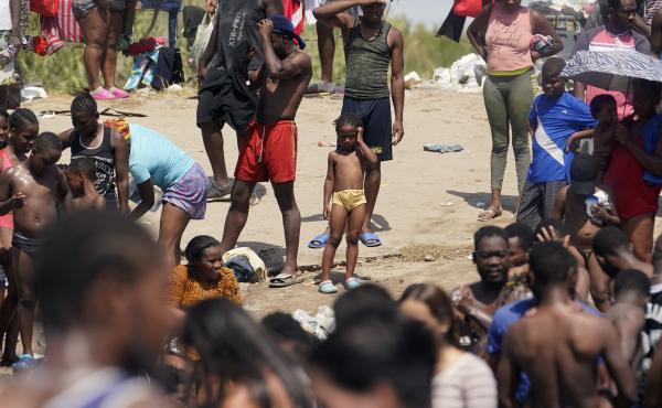 Haitian migrants gather on the banks of the Rio Grande on Saturday after they crossed into the United States from Mexico. Haitian migrants gather on the banks of the Rio Grande on Saturday after they crossed into the United States from Mexico.