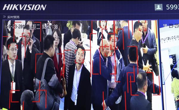 Visitors are tracked by face recognition technology from state-owned surveillance equipment manufacturer Hikvision at the Security China 2018 expo in Beijing. Hikvision is one of several firms that have been added to a U.S. trade blacklist. Visitors are tracked by face recognition technology from state-owned surveillance equipment manufacturer Hikvision at the Security China 2018 expo in Beijing. Hikvision is one of several firms that have been added to a U.S. trade blacklist.