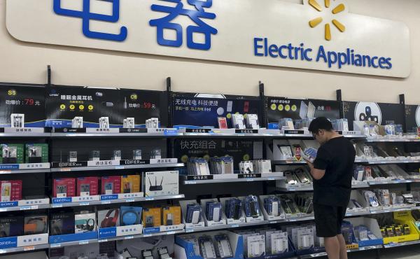 A shopper browses digital products at a market in Beijing. Trade tensions between China and the United States have grown significantly this week, after the Trump administration accused Beijing of backing down from commitments it had made in trade negotiat A shopper browses digital products at a market in Beijing. Trade tensions between China and the United States have grown significantly this week, after the Trump administration accused Beijing of backing down from commitments it had made in trade negotiat