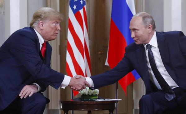 President Trump and Russian President Vladimir Putin shake hands at their summit in Helsinki, Finland, on Monday. Trump upset many in the U.S. intelligence community by refusing to endorse their finding that Russia interfered in the 2016 presidential elec President Trump and Russian President Vladimir Putin shake hands at their summit in Helsinki, Finland, on Monday. Trump upset many in the U.S. intelligence community by refusing to endorse their finding that Russia interfered in the 2016 presidential elec