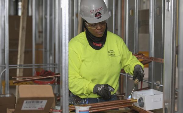 Plumber Zakiyyah Askia welds pipes at a high-rise residence under construction in Chicago on Jan. 24. U.S. employers added 196,000 jobs in March, a rebound from February's weak growth, the Labor Department said Friday. Plumber Zakiyyah Askia welds pipes at a high-rise residence under construction in Chicago on Jan. 24. U.S. employers added 196,000 jobs in March, a rebound from February's weak growth, the Labor Department said Friday.