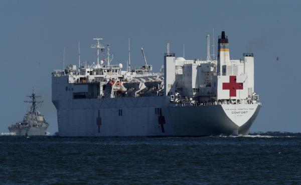 USNS Comfort, seen in 2017, is one of two U.S. Navy hospital ships — along with the USNS Mercy — that are preparing to deploy to assist medical workers expecting to grapple with an influx of patients in the weeks to come. USNS Comfort, seen in 2017, is one of two U.S. Navy hospital ships — along with the USNS Mercy — that are preparing to deploy to assist medical workers expecting to grapple with an influx of patients in the weeks to come.