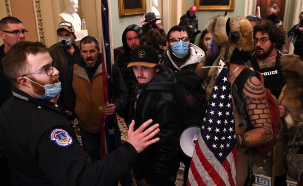 Jacob Chansley, the "QAnon Shaman" known for his painted face and horned hat, was taken into custody in Arizona in connection with the assault on the U.S. Capitol on Jan 6. Jacob Chansley, the "QAnon Shaman" known for his painted face and horned hat, was taken into custody in Arizona in connection with the assault on the U.S. Capitol on Jan 6.
