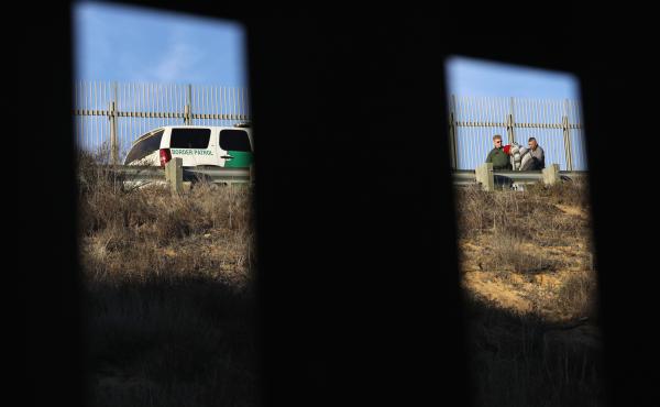 A U.S. Border Patrol agent takes an immigrant into custody in December 2018. Numerous members of the migrant caravan crossed over from Tijuana to San Diego but were quickly taken into custody by U.S. Border Patrol agents. A U.S. Border Patrol agent takes an immigrant into custody in December 2018. Numerous members of the migrant caravan crossed over from Tijuana to San Diego but were quickly taken into custody by U.S. Border Patrol agents.
