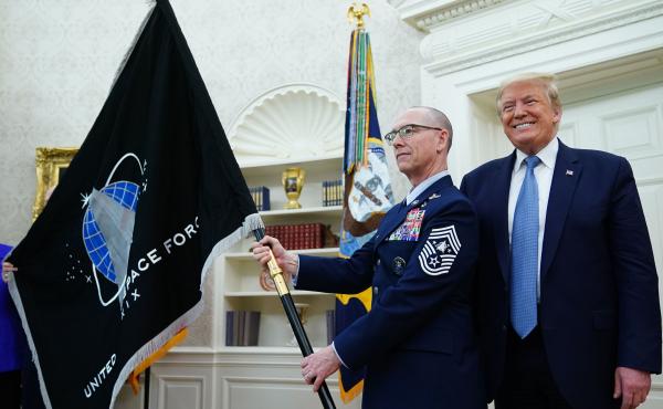 President Trump presedisplays the U.S. Space Force flag in the Oval Office last May. The new command plans to move its headquarters from a temporary location in Colorado to Alabama in 2023. President Trump presedisplays the U.S. Space Force flag in the Oval Office last May. The new command plans to move its headquarters from a temporary location in Colorado to Alabama in 2023.