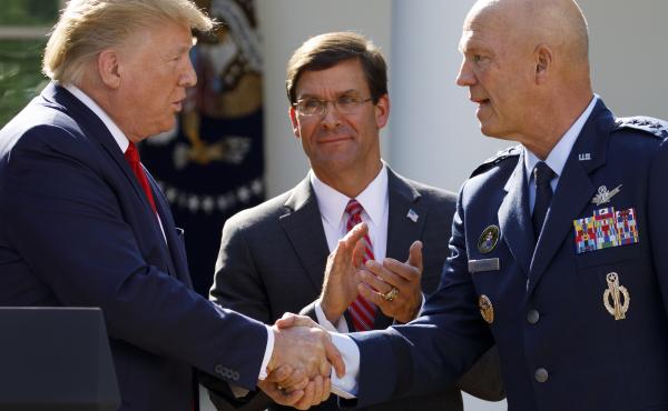 Gen. John "Jay" Raymond, with President Trump and Defense Secretary Mark Esper during a ceremony to establish the U.S. Space Command last summer. Gen. John "Jay" Raymond, with President Trump and Defense Secretary Mark Esper during a ceremony to establish the U.S. Space Command last summer.