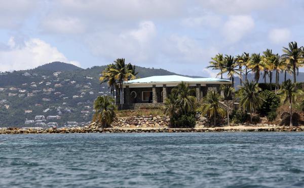 A view of Jeffrey Epstein's stone mansion on Little St. James Island. Prosecutors in the Virgin Islands on Tuesday filed a civil lawsuit that accuses Epstein of human trafficking that victimized young women and children as young as 11 years old. Some of t A view of Jeffrey Epstein's stone mansion on Little St. James Island. Prosecutors in the Virgin Islands on Tuesday filed a civil lawsuit that accuses Epstein of human trafficking that victimized young women and children as young as 11 years old. Some of t