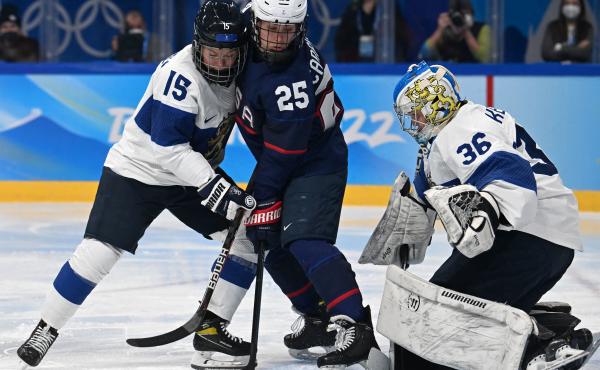 Finland's Minnamari Tuominen (left) and Team USA's Alexandra Carpenter vie for the puck next to Finland's goaltender Anni Keisala during the women's ice hockey semi-final match of the Beijing 2022 Winter Olympic Games. Finland's Minnamari Tuominen (left) and Team USA's Alexandra Carpenter vie for the puck next to Finland's goaltender Anni Keisala during the women's ice hockey semi-final match of the Beijing 2022 Winter Olympic Games.