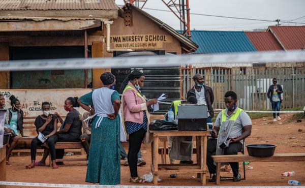 Ugandan election commission officials count ballots after the polls closed at a polling station in Kampala on Thursday. Ugandan election commission officials count ballots after the polls closed at a polling station in Kampala on Thursday.