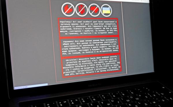 A laptop screen displays a warning message in Ukrainian, Russian and Polish that appeared on the official website of the Ministry of Foreign Affairs of Ukraine after a massive cyberattack on Friday. A laptop screen displays a warning message in Ukrainian, Russian and Polish that appeared on the official website of the Ministry of Foreign Affairs of Ukraine after a massive cyberattack on Friday.