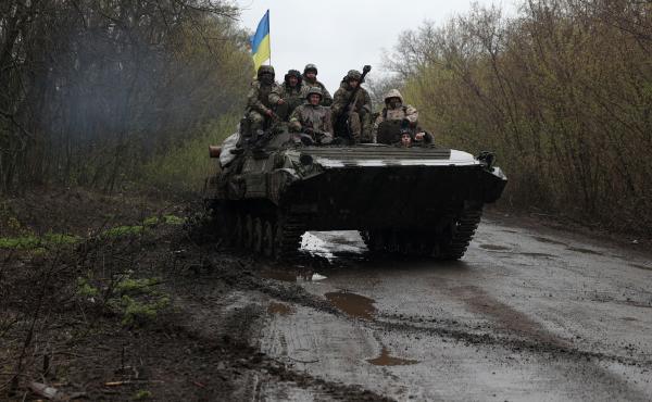 Ukrainian soldiers stand on an armored personnel carrier not far from the front line with Russian troops in Izyum district, Kharkiv region, on Monday. Ukrainian soldiers stand on an armored personnel carrier not far from the front line with Russian troops in Izyum district, Kharkiv region, on Monday.