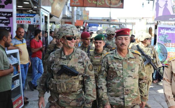 U.S. Army Lt. Gen. Paul Funk (left), and Iraqi Maj. Gen. Najm Abdullah al-Jibouri, walk through a busy market in Mosul, Iraq, on Oct. 4. U.S. forces in Iraq, Syria and Afghanistan have been increasing this year under President Trump, going from about 18,0 U.S. Army Lt. Gen. Paul Funk (left), and Iraqi Maj. Gen. Najm Abdullah al-Jibouri, walk through a busy market in Mosul, Iraq, on Oct. 4. U.S. forces in Iraq, Syria and Afghanistan have been increasing this year under President Trump, going from about 18,0
