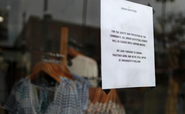 An Urban Outfitters store displays a closed sign in Santa Monica, Calif. With businesses shutting down around the country, a flood of new unemployment claims are pouring in. An Urban Outfitters store displays a closed sign in Santa Monica, Calif. With businesses shutting down around the country, a flood of new unemployment claims are pouring in.
