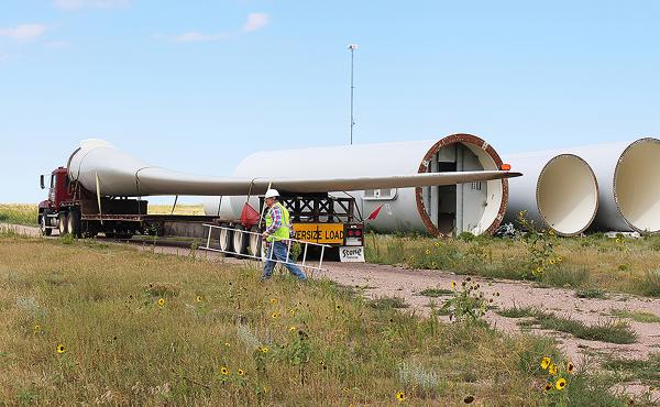 Rob Van Vleet secures a wind turbine blade on to an oversize truck at the Kimball Wind Farm in southwest Nebraska. Rob Van Vleet secures a wind turbine blade on to an oversize truck at the Kimball Wind Farm in southwest Nebraska.