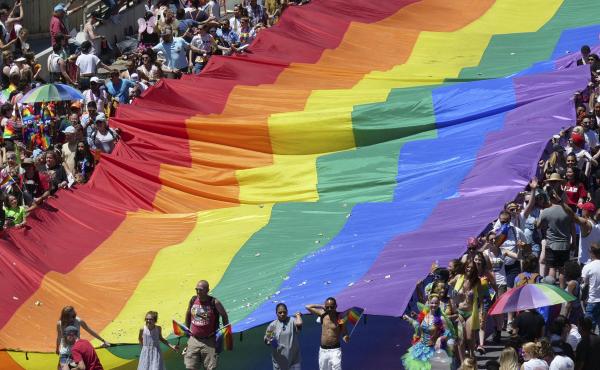 Marchers raise a rainbow flag during the 2018 Pride parade in Salt Lake City. Late Tuesday, state regulators implemented a ban on "conversion therapy" aimed at changing the sexual orientation or gender identity of LGBTQ young people. Marchers raise a rainbow flag during the 2018 Pride parade in Salt Lake City. Late Tuesday, state regulators implemented a ban on "conversion therapy" aimed at changing the sexual orientation or gender identity of LGBTQ young people.