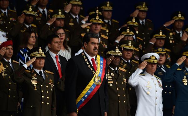 According to The New York Times, Trump administration officials met with coup plotters who wanted to oust Venezuelan President Nicolas Maduro (center), shown here at a ceremony last month. According to The New York Times, Trump administration officials met with coup plotters who wanted to oust Venezuelan President Nicolas Maduro (center), shown here at a ceremony last month.