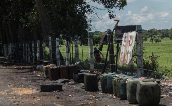 Contraband fuel sits on the side of a road in Puerto Santander, Colombia, on May 31, 2019. The Venezuelan government's lack of cash to import gasoline combined with U.S. sanctions targeting the oil sector have led to chronic fuel shortages in Venezuela. T Contraband fuel sits on the side of a road in Puerto Santander, Colombia, on May 31, 2019. The Venezuelan government's lack of cash to import gasoline combined with U.S. sanctions targeting the oil sector have led to chronic fuel shortages in Venezuela. T