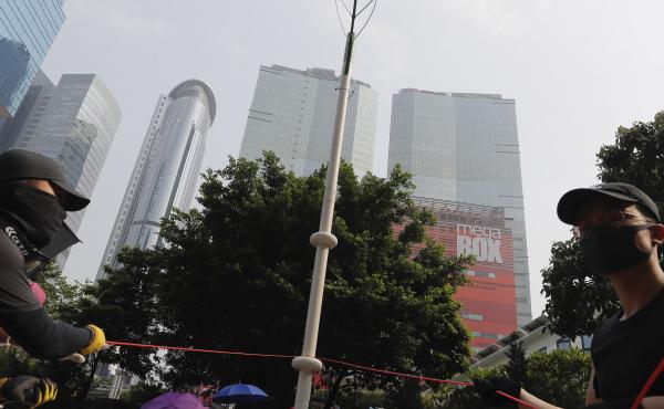 Demonstrators try to pull down a smart lamppost during the protest in Hong Kong on Saturday that turned violent. The smart lampposts are raising fears of stepped-up surveillance from authorities. Demonstrators try to pull down a smart lamppost during the protest in Hong Kong on Saturday that turned violent. The smart lampposts are raising fears of stepped-up surveillance from authorities.