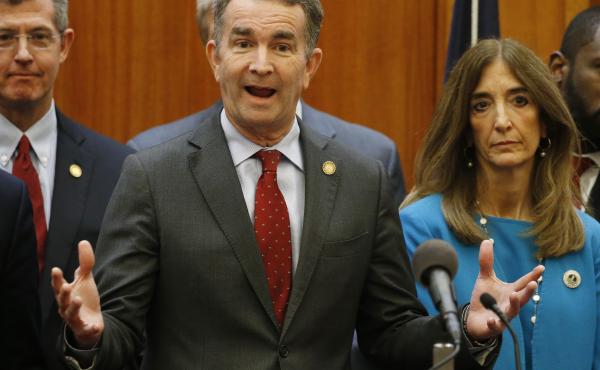 Virginia Gov. Ralph Northam, (front) announced schools in the state will remained closed for at least the rest of the academic school year. Virginia Gov. Ralph Northam, (front) announced schools in the state will remained closed for at least the rest of the academic school year.