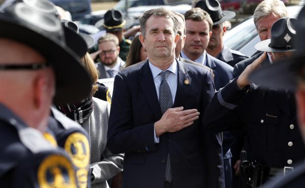 Virginia Gov. Ralph Northam places hand over his heart at a funeral for a state trooper Saturday in Chilhowie, Va., during one of his first public appearances since the blackface scandal broke. Virginia Gov. Ralph Northam places hand over his heart at a funeral for a state trooper Saturday in Chilhowie, Va., during one of his first public appearances since the blackface scandal broke.