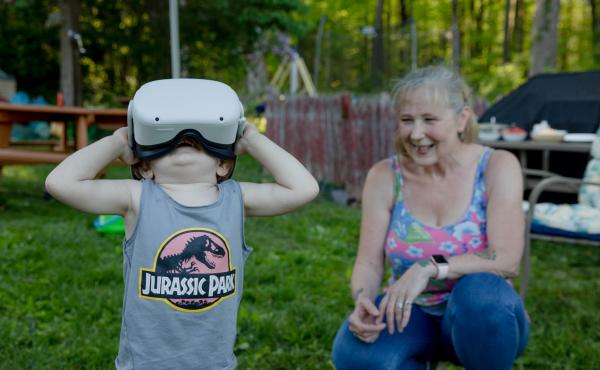 Linda Munson's youngest grandson, Daniel Gomez, 2, tries on an Oculus headset in her yard in Berlin, Conn. Playing different virtual reality games has become her family's regular Sunday activity, Munson said. Linda Munson's youngest grandson, Daniel Gomez, 2, tries on an Oculus headset in her yard in Berlin, Conn. Playing different virtual reality games has become her family's regular Sunday activity, Munson said.