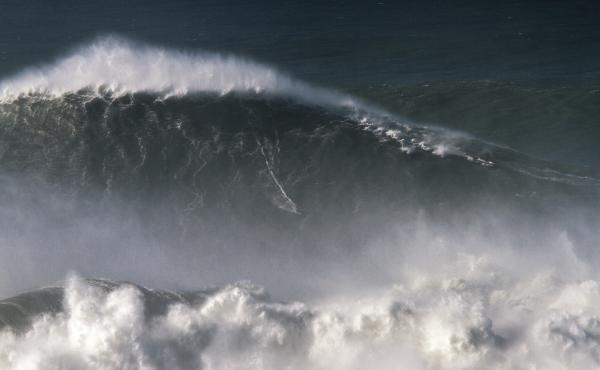 Trust us: Brazilian surfer Rodrigo Koxa is somewhere in this shot of his 80-foot ride last November in Nazaré, Portugal. Trust us: Brazilian surfer Rodrigo Koxa is somewhere in this shot of his 80-foot ride last November in Nazaré, Portugal.