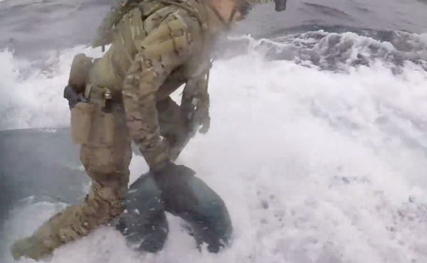 U.S. Coast Guard Cutter Munro crew members board a semi-submersible suspected of carrying drugs on June 18 while operating in international waters of the Eastern Pacific Ocean. U.S. Coast Guard Cutter Munro crew members board a semi-submersible suspected of carrying drugs on June 18 while operating in international waters of the Eastern Pacific Ocean.