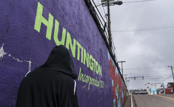 A pedestrian walks past a mural in Huntington, W.Va., on March 18. Huntington was once ground zero for the U.S. opioid epidemic. A pedestrian walks past a mural in Huntington, W.Va., on March 18. Huntington was once ground zero for the U.S. opioid epidemic.