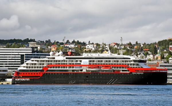 The expedition cruise ship MS Roald Amundsen is moored at a quay in Tromso, Norway, on Saturday. At least 36 crew members from the ship have tested positive for the coronavirus. The expedition cruise ship MS Roald Amundsen is moored at a quay in Tromso, Norway, on Saturday. At least 36 crew members from the ship have tested positive for the coronavirus.