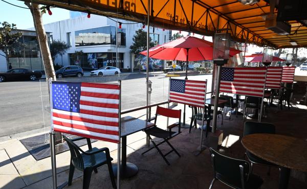 Patio tables are empty at a diner this week in West Hollywood, Calif., after Los Angeles County banned outdoor dining amid the pandemic. The struggles of restaurants and retailers are expected to have led to sharply slower job growth last month. Patio tables are empty at a diner this week in West Hollywood, Calif., after Los Angeles County banned outdoor dining amid the pandemic. The struggles of restaurants and retailers are expected to have led to sharply slower job growth last month.