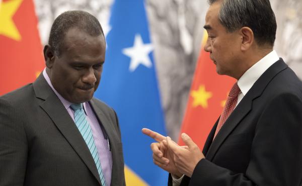 Solomon Islands Foreign Minister Jeremiah Manele, left, and Chinese Foreign Minister Wang Yi talk during a ceremony to mark the establishment of diplomatic relations between the Solomon Islands and China at the Diaoyutai State Guesthouse in Beijing on Sep Solomon Islands Foreign Minister Jeremiah Manele, left, and Chinese Foreign Minister Wang Yi talk during a ceremony to mark the establishment of diplomatic relations between the Solomon Islands and China at the Diaoyutai State Guesthouse in Beijing on Sep