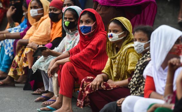 Workers from the garment sector block a road during a protest to demand payment of due wages, in Dhaka, Bangladesh, in April 2020. They claimed that factories had not paid them after retailers and brands cancelled orders due to worldwide lockdown measures Workers from the garment sector block a road during a protest to demand payment of due wages, in Dhaka, Bangladesh, in April 2020. They claimed that factories had not paid them after retailers and brands cancelled orders due to worldwide lockdown measures