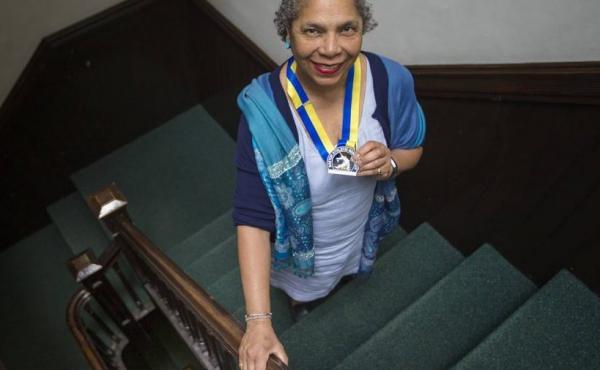 "If my life were to end next week ... I want to feel like I have made a contribution," said Carol Martin, seen here holding her 2018 Boston Marathon medal. "If my life were to end next week ... I want to feel like I have made a contribution," said Carol Martin, seen here holding her 2018 Boston Marathon medal.