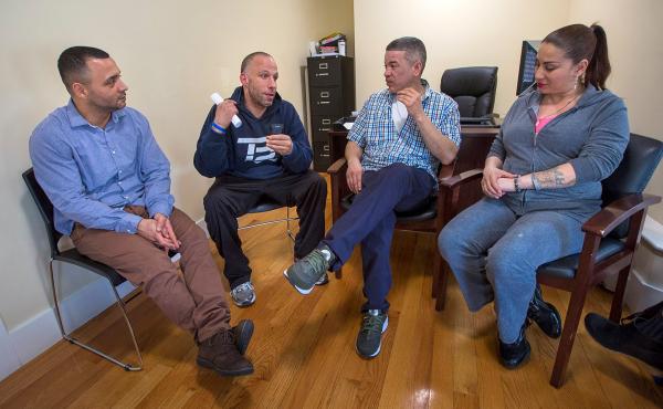 From left to right: Felito Diaz, Julio Cesar Santiago, Richard Lopez and Irma Bermudez meet at Casa Esperanza, a treatment and transitional housing program in Roxbury, Mass. From left to right: Felito Diaz, Julio Cesar Santiago, Richard Lopez and Irma Bermudez meet at Casa Esperanza, a treatment and transitional housing program in Roxbury, Mass.