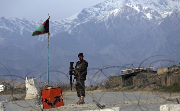 An Afghan National Army soldier stands guard at a checkpoint near the Bagram airfield, the largest U.S. military base in Afghanistan, in April. An Afghan National Army soldier stands guard at a checkpoint near the Bagram airfield, the largest U.S. military base in Afghanistan, in April.