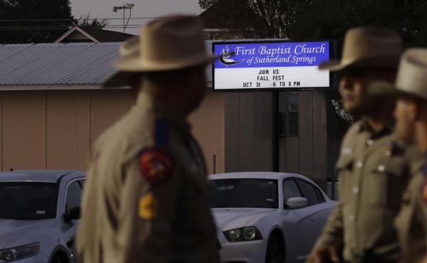 Law enforcement officials gather Monday at the scene of a deadly shooting the previous day at the First Baptist Church of Sutherland Springs in Texas. Law enforcement officials gather Monday at the scene of a deadly shooting the previous day at the First Baptist Church of Sutherland Springs in Texas.
