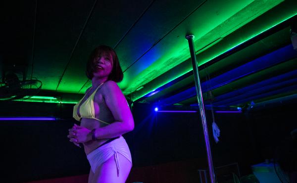 M. dances at a go-go bar. She was working as a topless dancer — and also as a sex worker — in the tourist city of Pattaya, Thailand, until the bar closed down in January. She decided to return to her hometown to look for work in a different sector. M. dances at a go-go bar. She was working as a topless dancer — and also as a sex worker — in the tourist city of Pattaya, Thailand, until the bar closed down in January. She decided to return to her hometown to look for work in a different sector.