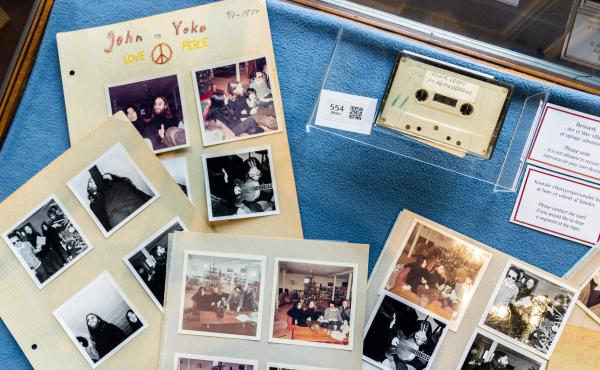 A cassette with the recording of teenage journalists' 1970 interview with John Lennon and Yoko Ono, along with polaroid photos from the conversation, seen at Bruun Rasmussen Auction House in Copenhagen on September 24, 2021. An unidentified bidder won the A cassette with the recording of teenage journalists' 1970 interview with John Lennon and Yoko Ono, along with polaroid photos from the conversation, seen at Bruun Rasmussen Auction House in Copenhagen on September 24, 2021. An unidentified bidder won the