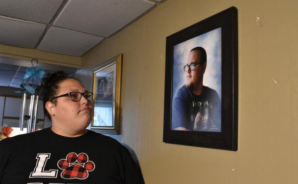 Stephanie Rimel looks at a photo of her brother Kyle Dixon, 27, who died of COVID-19 on Jan. 20. She says that during his illness and after his death, some people made insensitive comments or denied the pandemic's reality. Stephanie Rimel looks at a photo of her brother Kyle Dixon, 27, who died of COVID-19 on Jan. 20. She says that during his illness and after his death, some people made insensitive comments or denied the pandemic's reality.