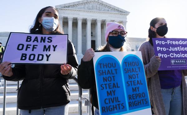 Caroline McDonald, left, a student at Georgetown University, Lauren Morrissey, with Catholics for Choice, and Pamela Huber, of Washington, join a abortion-rights rally outside the Supreme Court, Monday, Nov. 1, 2021. Caroline McDonald, left, a student at Georgetown University, Lauren Morrissey, with Catholics for Choice, and Pamela Huber, of Washington, join a abortion-rights rally outside the Supreme Court, Monday, Nov. 1, 2021.