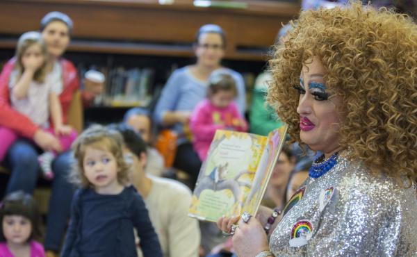 Lil Miss Hot Mess reads to children during a Drag Queen Story Hour in Brooklyn, NY. The event is held in libraries across the country, including, in the past, at the Carnegie Library of Pittsburgh. Lil Miss Hot Mess reads to children during a Drag Queen Story Hour in Brooklyn, NY. The event is held in libraries across the country, including, in the past, at the Carnegie Library of Pittsburgh.