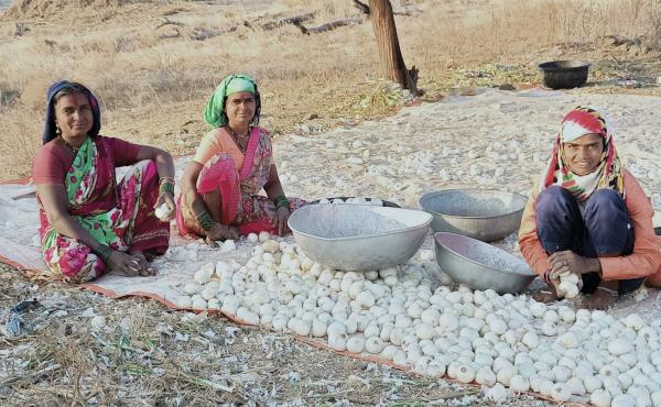 Field hockey star Sarita Bhise (right) with her mother (far left) and maternal aunt, cleaning onions they've harvested on the family farm. Field hockey star Sarita Bhise (right) with her mother (far left) and maternal aunt, cleaning onions they've harvested on the family farm.