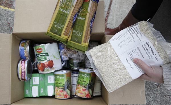 A box of food prepared at a food bank distribution in Petaluma, Calif. The state ranks near the bottom in enrolling people for food assistance. To change that, it's taking lessons from its robust Medi-Cal health insurance program, which targets much the s A box of food prepared at a food bank distribution in Petaluma, Calif. The state ranks near the bottom in enrolling people for food assistance. To change that, it's taking lessons from its robust Medi-Cal health insurance program, which targets much the s