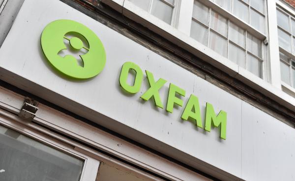 An Oxfam sign outside one of its charity shops in central London, where they sell secondhand goods to raise funds. An Oxfam sign outside one of its charity shops in central London, where they sell secondhand goods to raise funds.